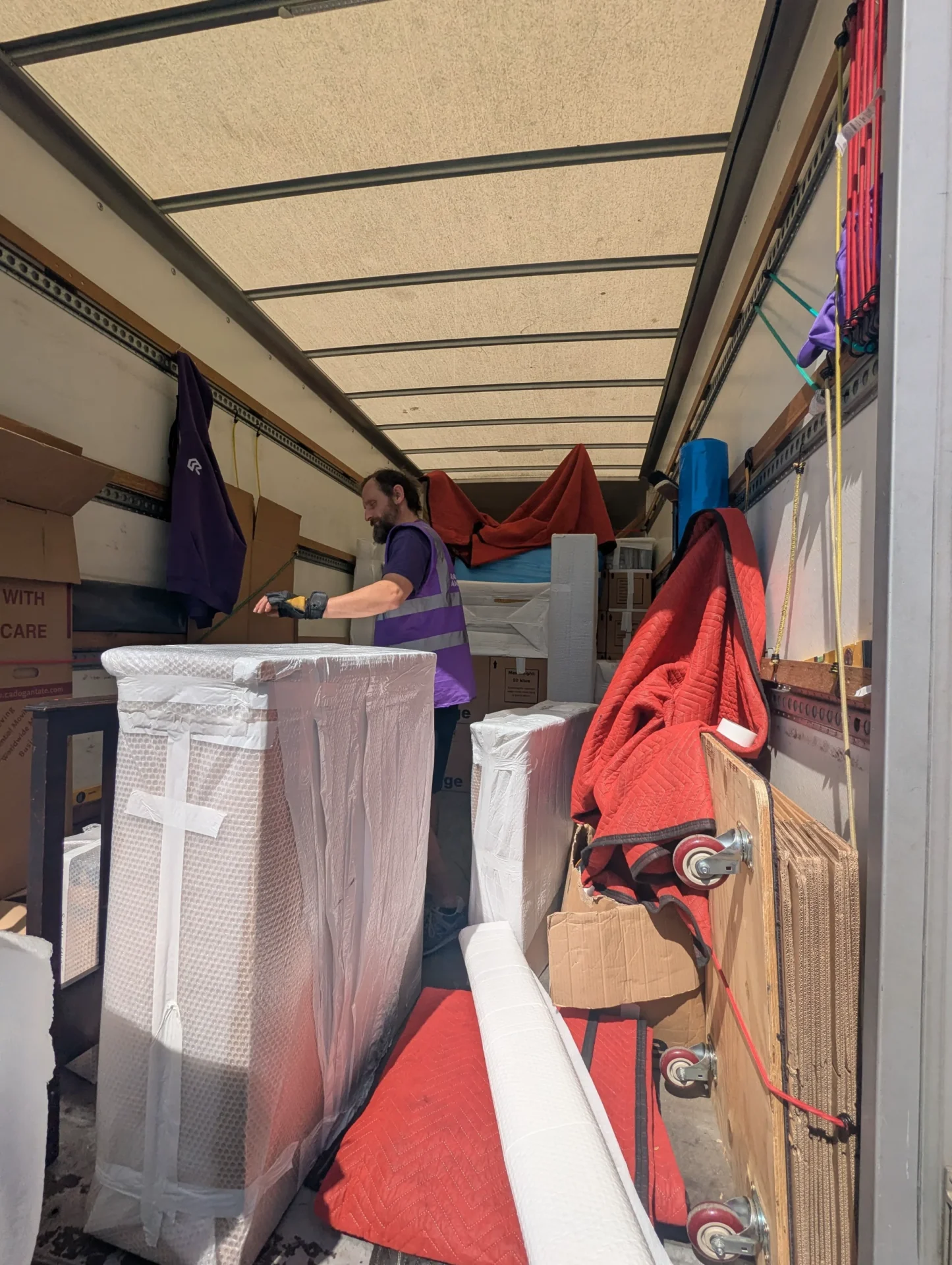 Protected client furniture inside Rad Removals van as Michael prepares to unload into London storage units